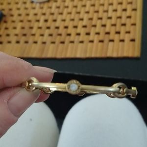Gold coach bracelet